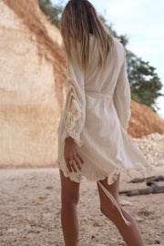 Ayumi Dress in Natural White - Organic Cotton and Linen Blend with Hand-Beaded Belt, Adjustable Sleeves, and Fringe Edges. Perfect for Elegant, Sustainable Fashion